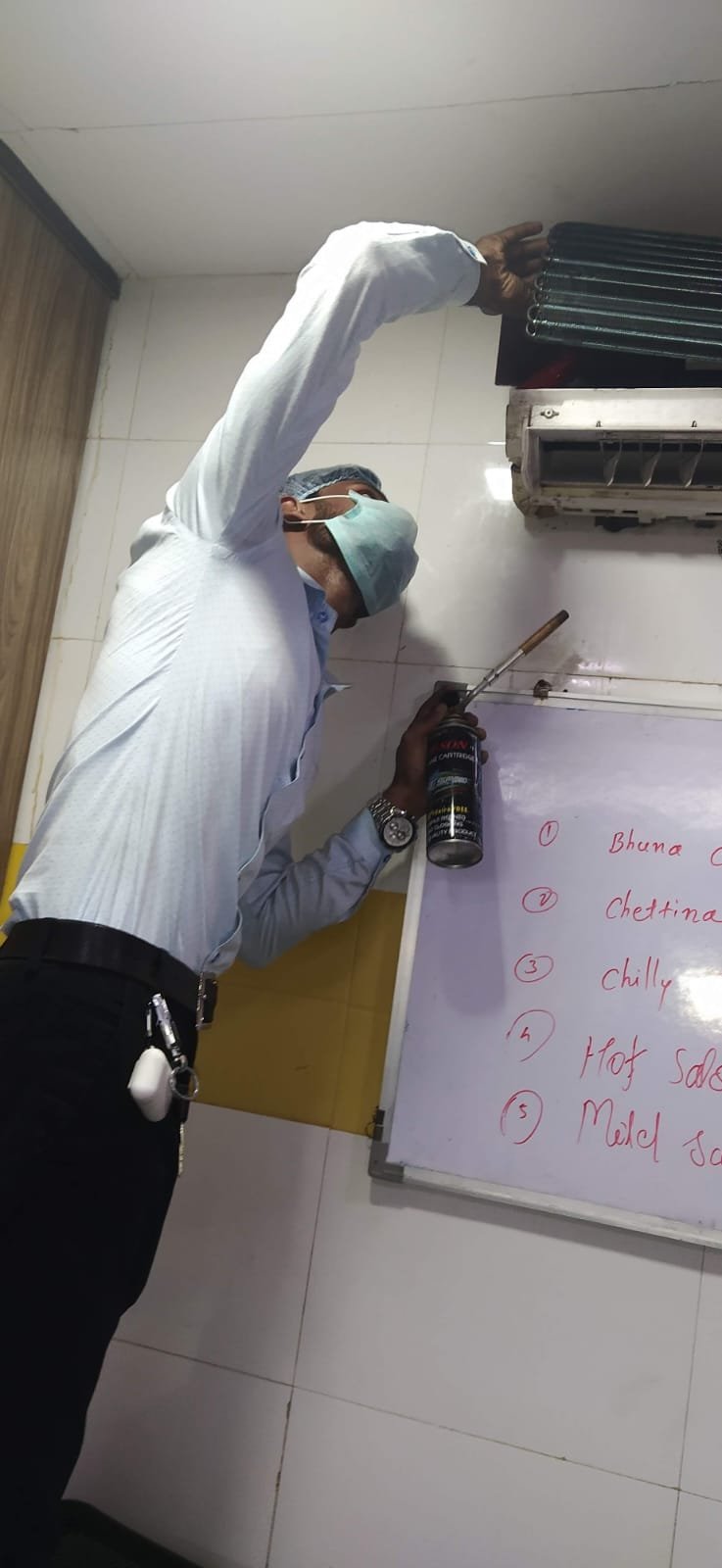 Technician repairing washing machine in Bhiwandi